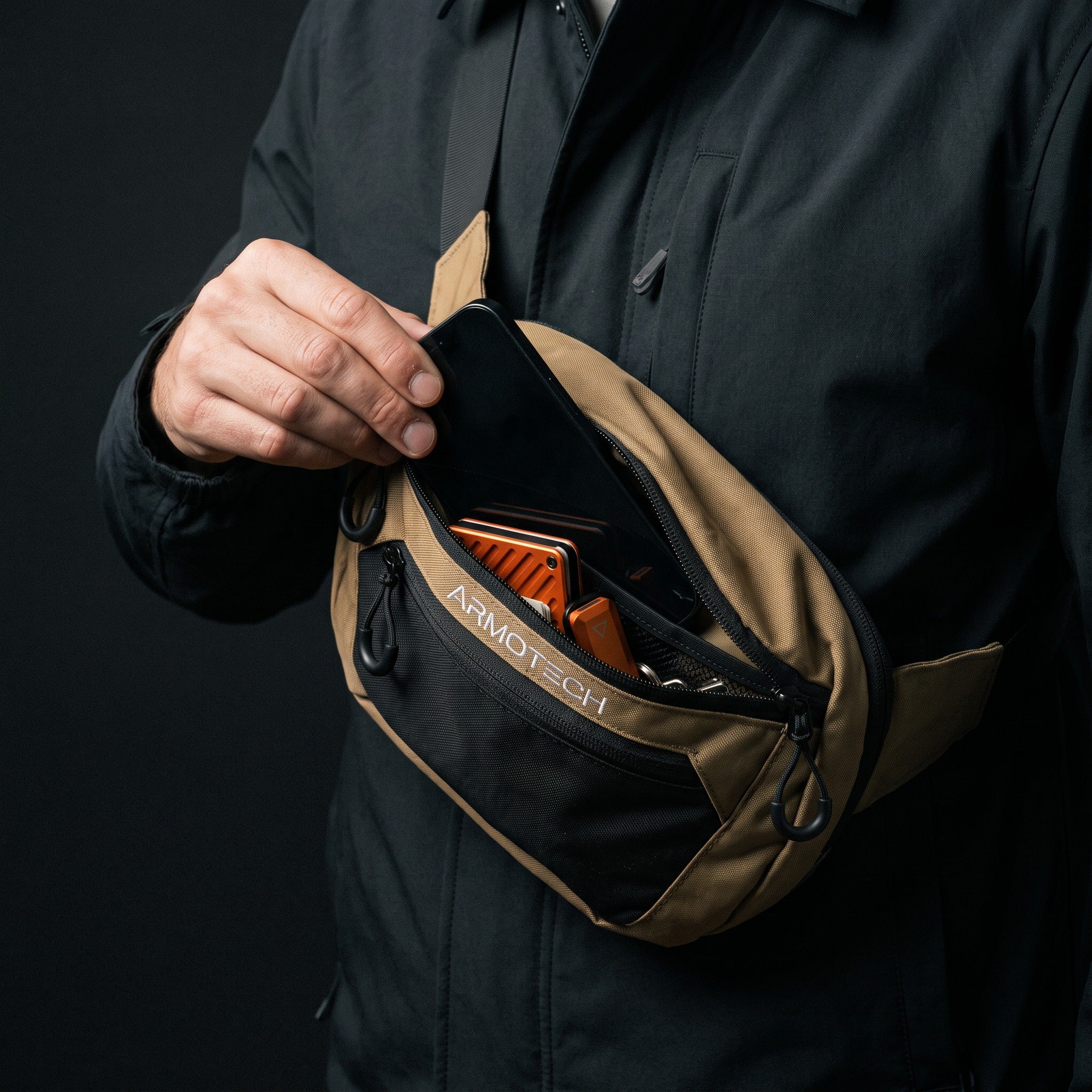 Desert Tan ARMOTECH EDC Bag worn crossbody with a phone, wallet and keys within reach