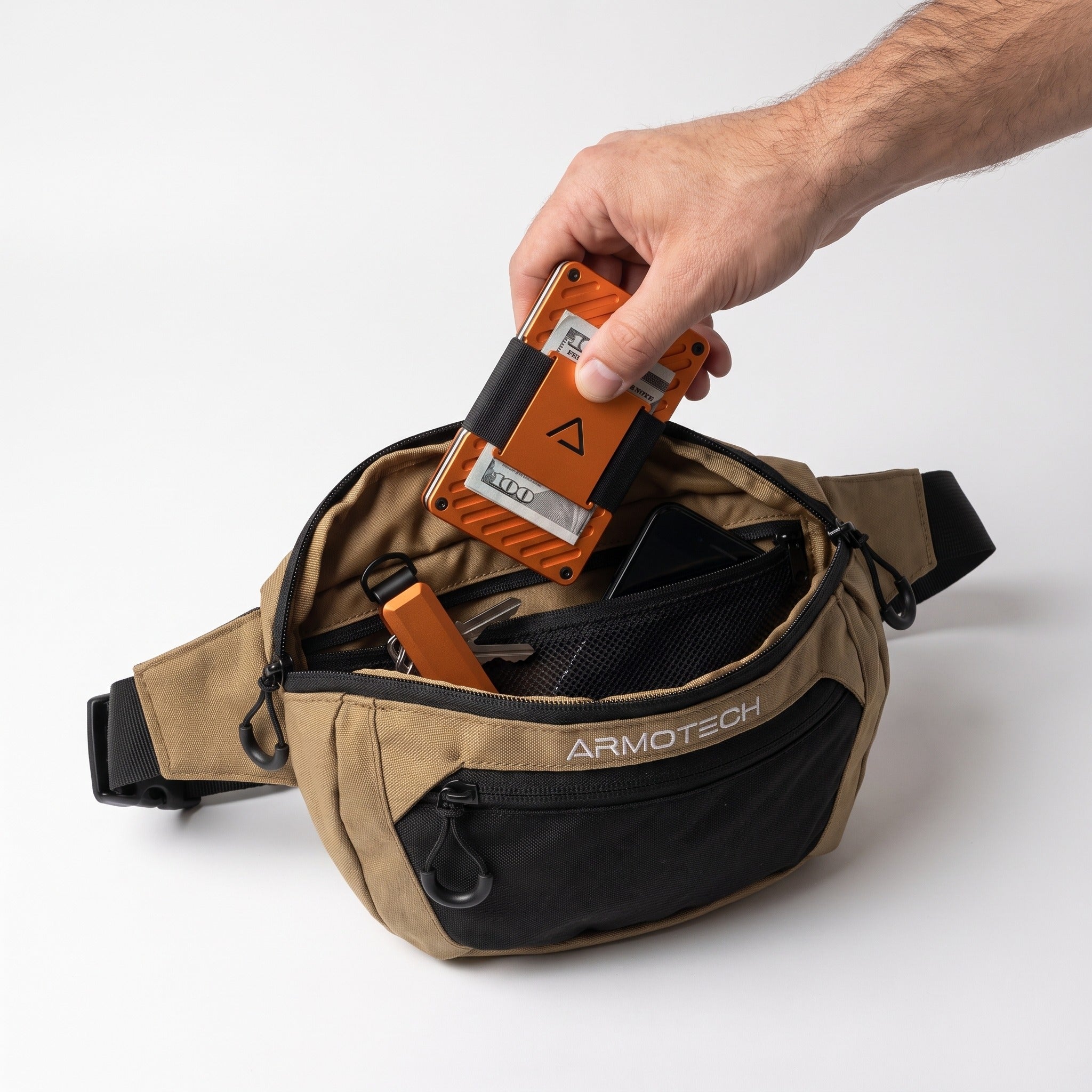 Desert Tan ARMOTECH EDC Bag with a phone, orange wallet and keys organized inside